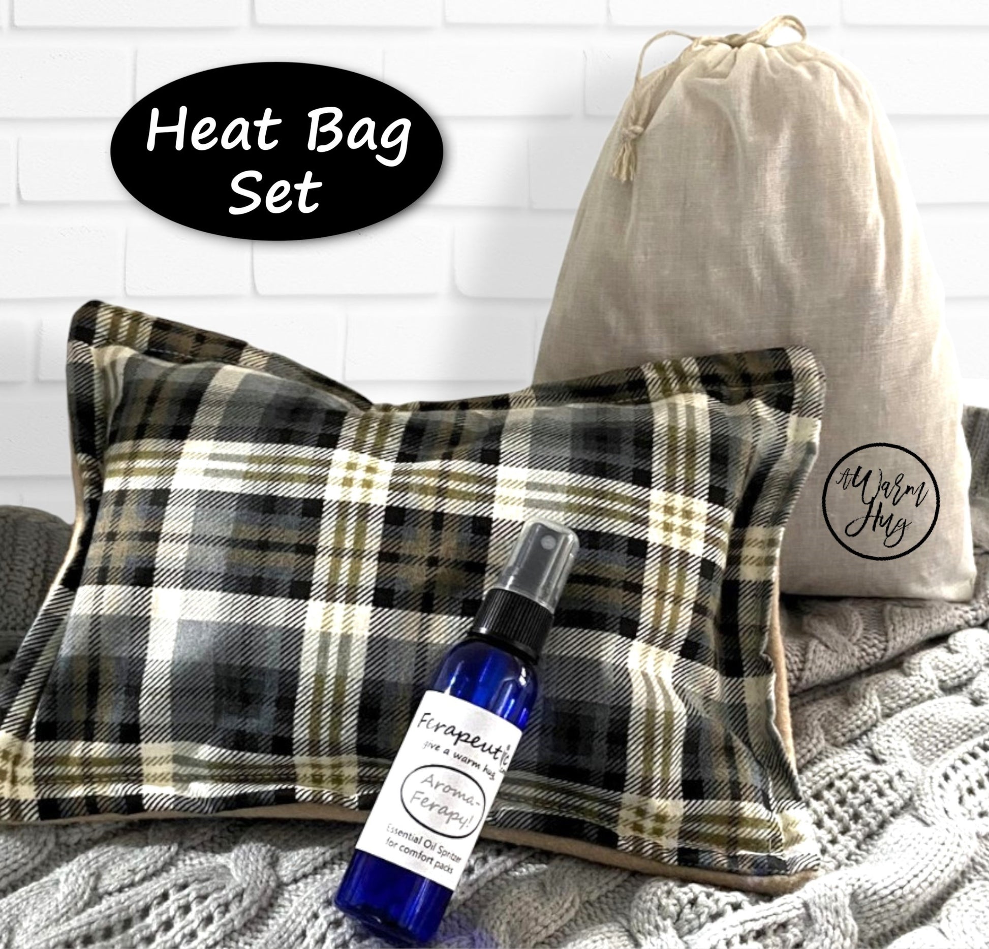 Heat bag set with plaid design, bottle of essential oil, and drawstring bag on a textured surface.