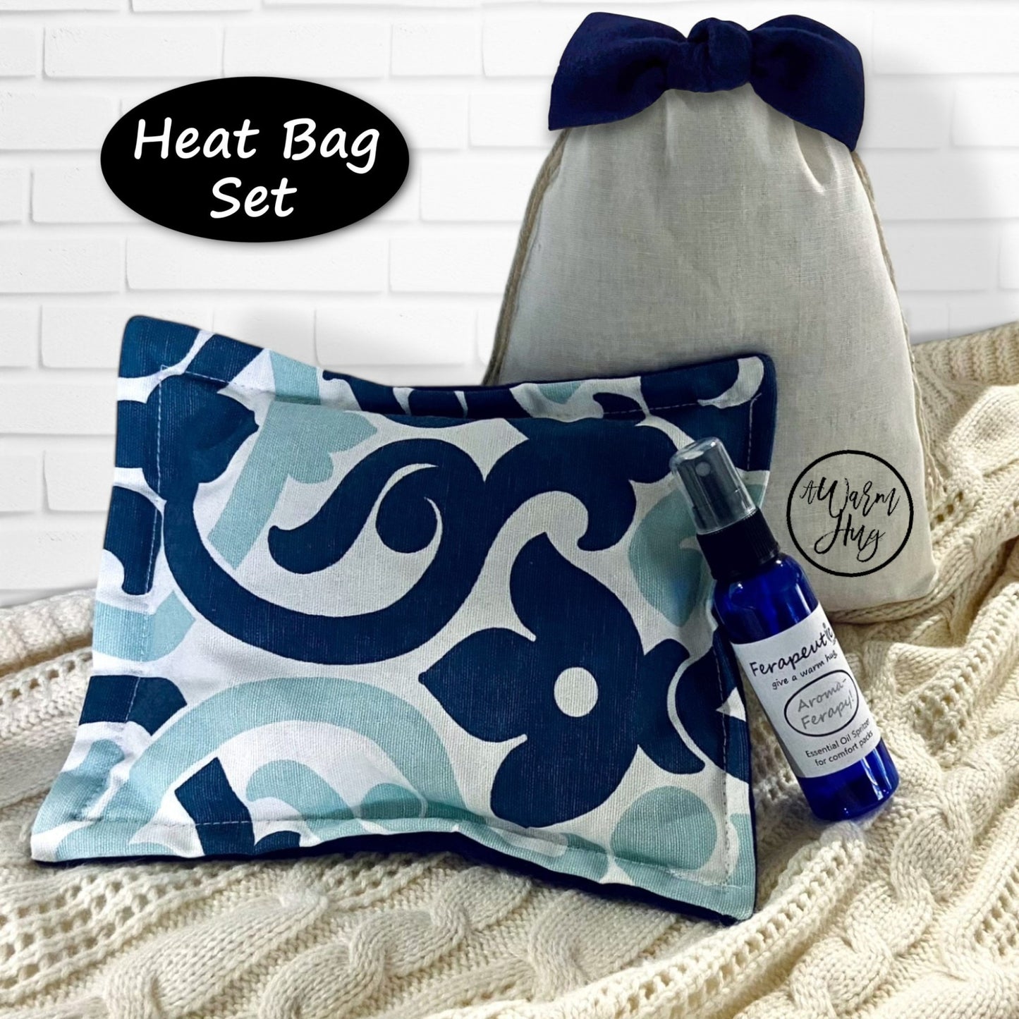 Heat bag set with decorative pillow and essential oil spray bottle on a textured surface