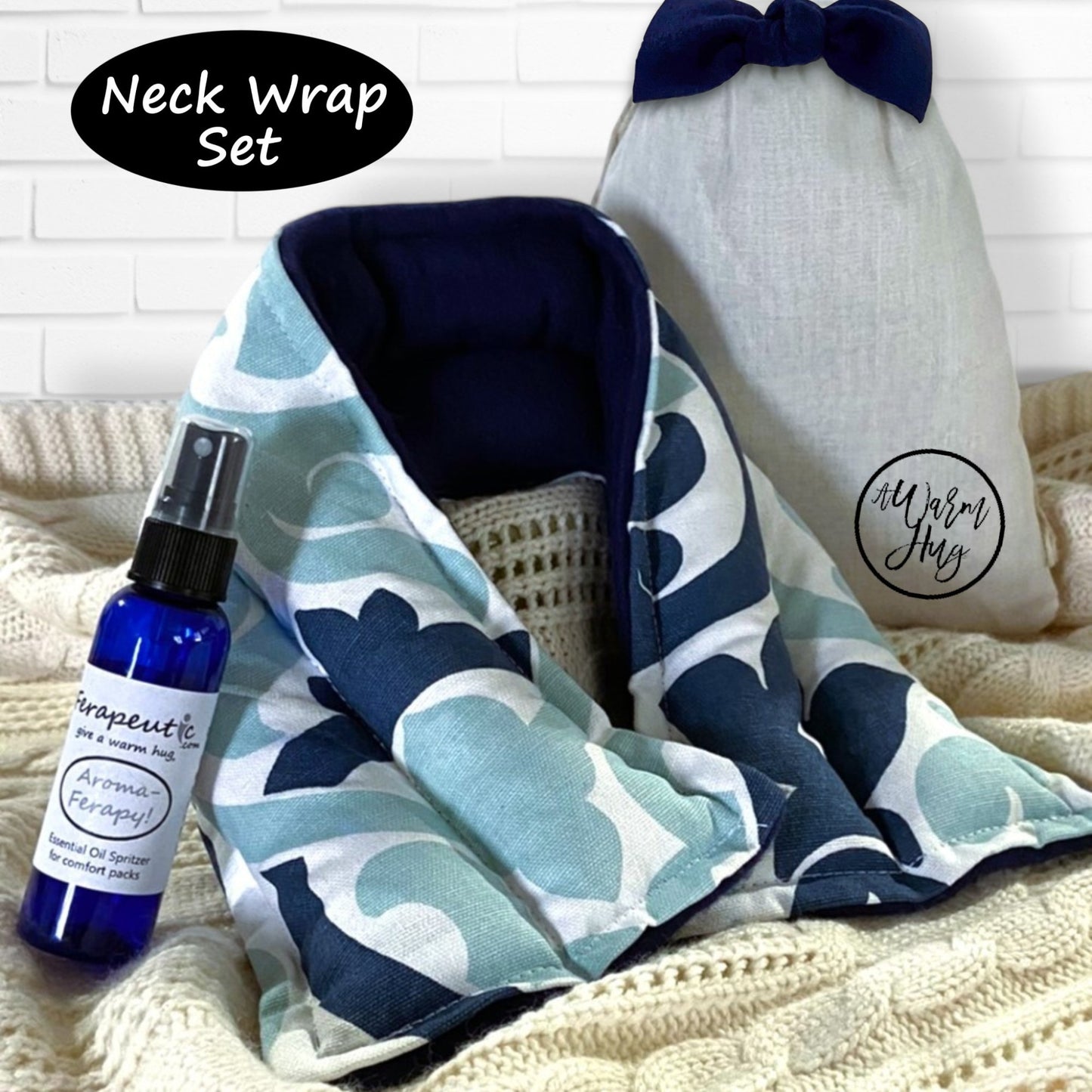 Neck wrap set with a lavender spray bottle labeled 'Therapeutic Aromatherapy' on a textured surface.