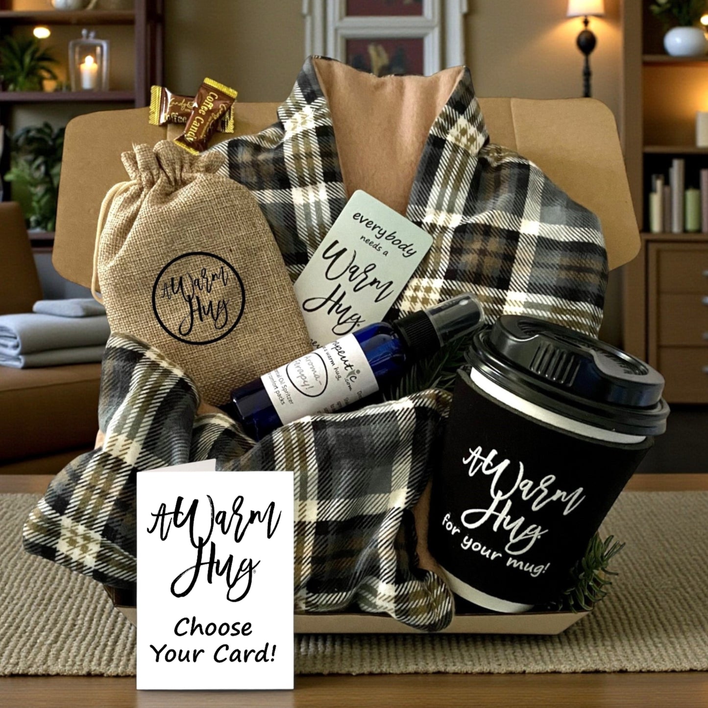 Warm Hug Gift basket with a mug, tan plaid heating pads and other items on a table.