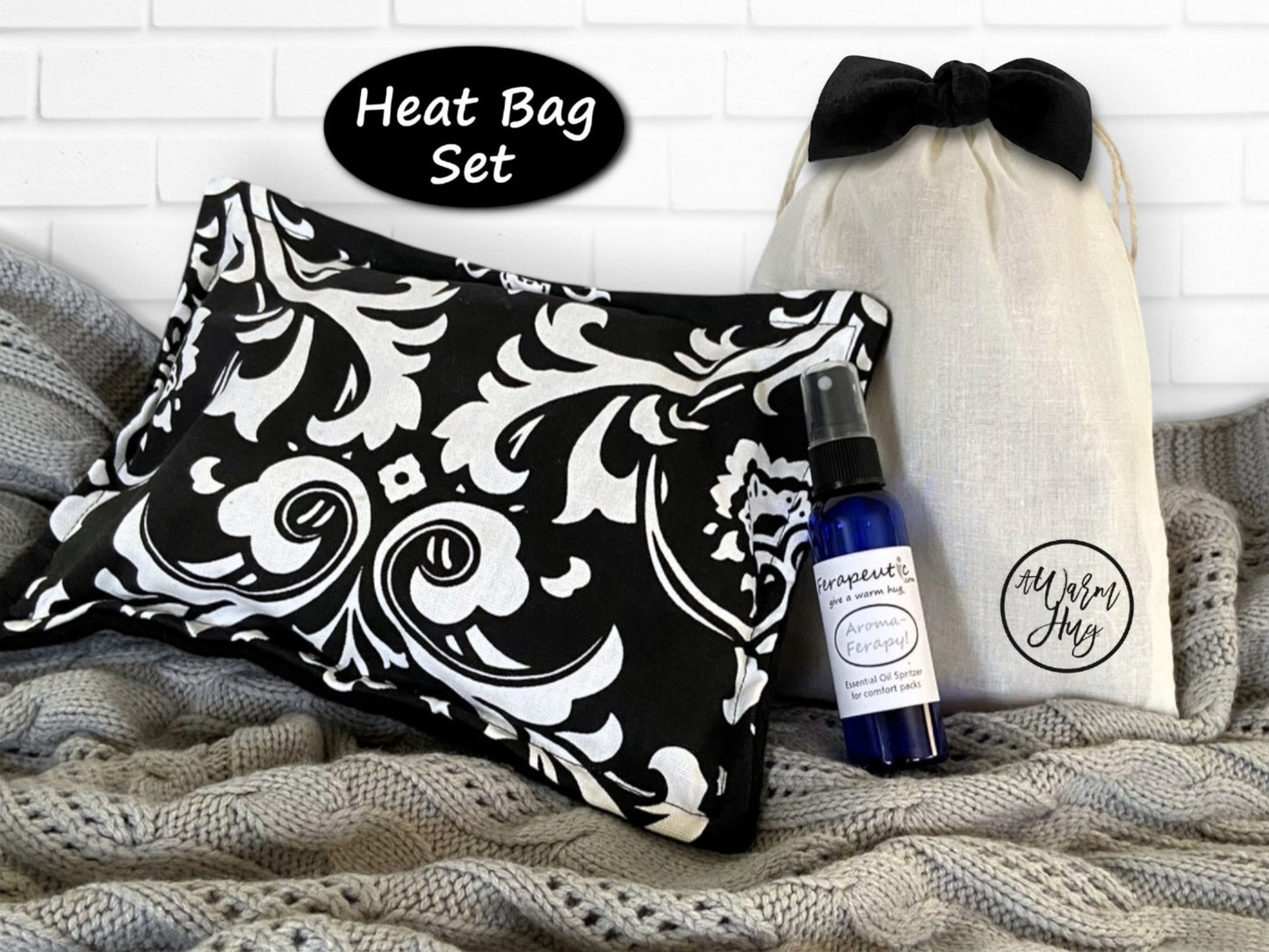 Heat bag set with black and white patterned bag, bottle, and drawstring bag on a textured surface.