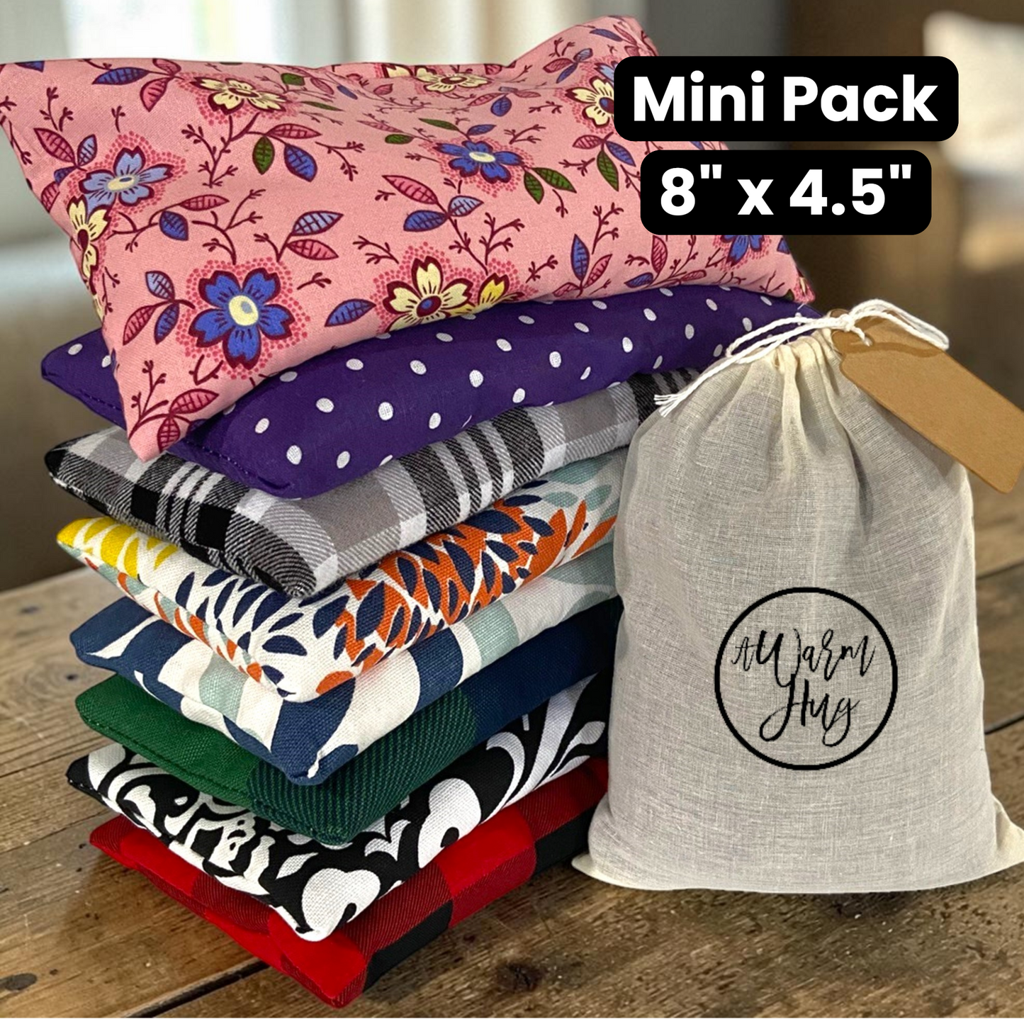 Stack of pretty hot cold packs with gift bag and the words mini pack with sizing