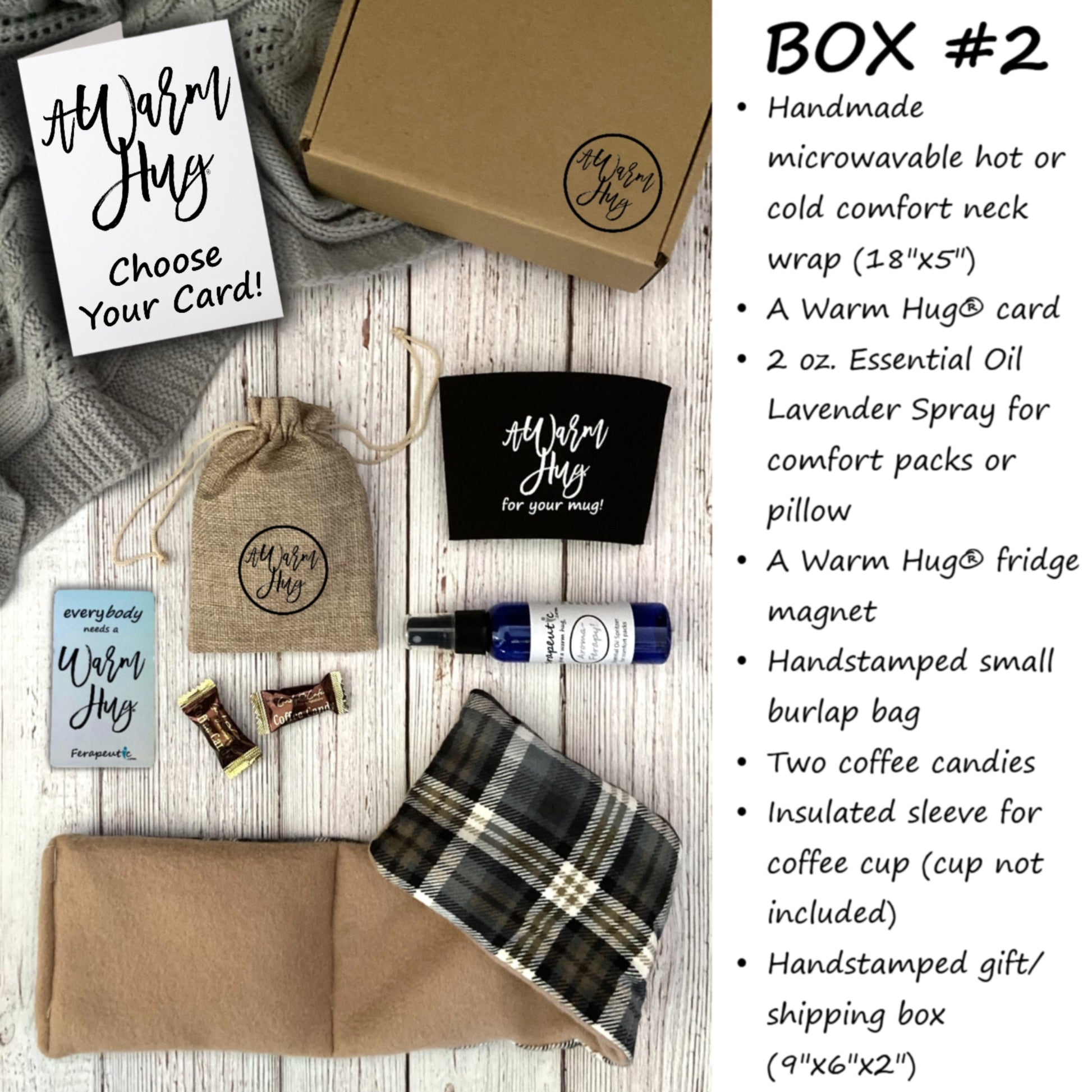 Collection of 'A Warm Hug' products including a box, card, and comfort wrap on a wooden surface.