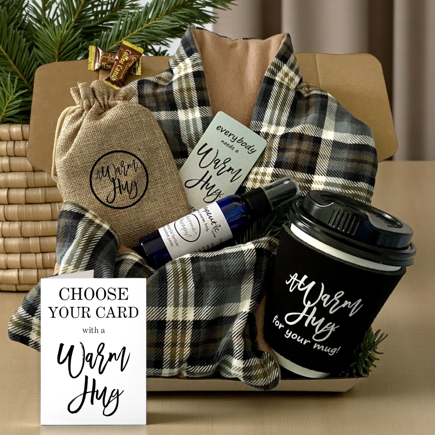 Gift basket for guy with tan plaid heating wraps, coffee cup, and small bottles on a table.