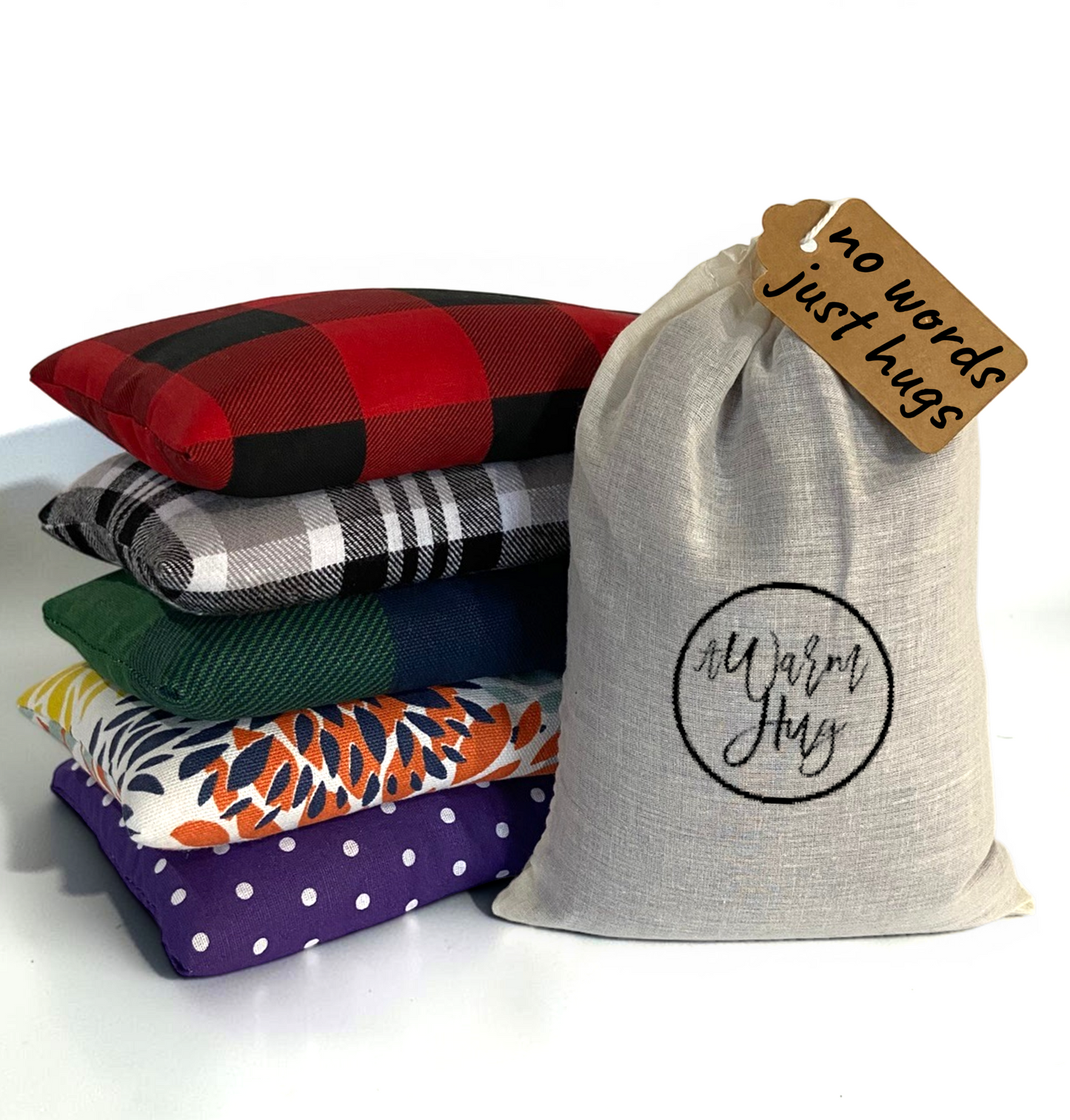 Gift bag and tag that says 'no words, just hugs' with colorful and cozy heat pads